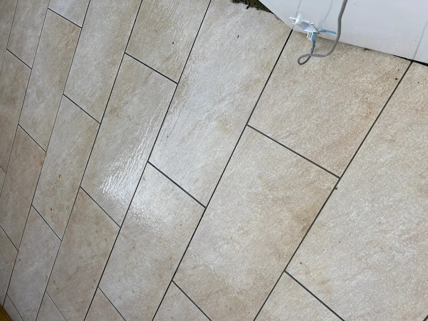 Freshly cleaned pale beige patio tiles